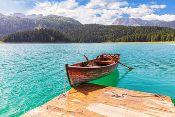Lonely boat in the Black Lake of the Durmitor area in Montenegro