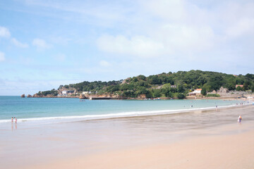 Fototapeta na wymiar View of the beach and the sea in the summer at St Brelade's Bay, Jersey