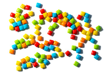 Candy. Colorful candies, dragee, chewing gum on a white isolated background top view frame copy space with a contrasting shadow. Advertising label design element. Full depth of field.