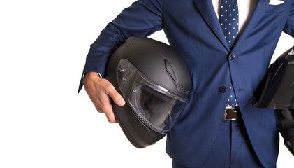 Business man holding motorbike and enduro bike helmets isolated in blue suit isolated in white background - concept image