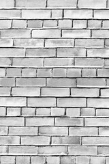 Vertical white empty brick old wall.