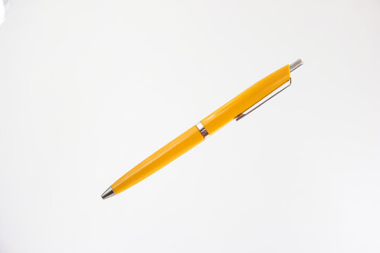 Vintage classic yellow pen close up diagonal shot isolated on white