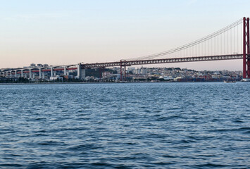 View of ponte de 25 abril bridge from a boat in the river