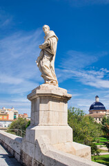 Naklejka premium Sculptural detail of a saint on the Trinidad bridge in Valencia