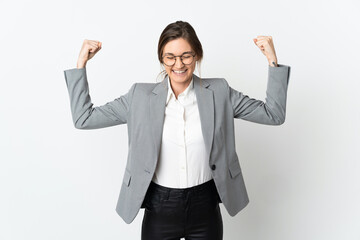 Business Ireland woman isolated on white background doing strong gesture