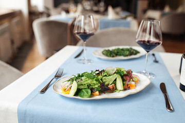 Fresh vegetables salad on served restaurant table