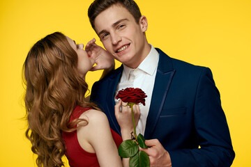 Couple in love man and woman with red rose classic costume red dress model