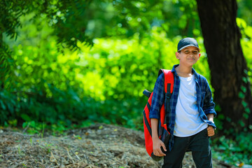 Naklejka premium Indian cute schoolboy with backpack, Back to school concept