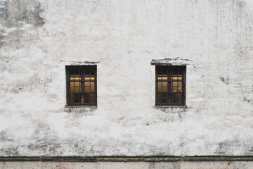 Background of two windows on white wall of traditonal Chinese architecture