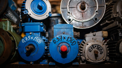 Electric motors. Industrial equipment for factories. Iron and equipment warehouse in the garage.
