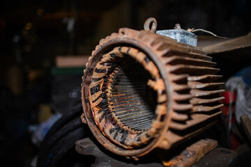 Rusty electric motor in a warehouse. Repair of electric motors in the garage. Industrial equipment...