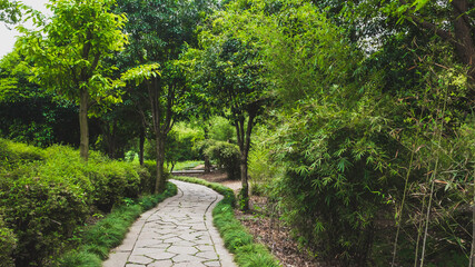 Footpath between trees in Lanting (Orchid Pavilion) scenic area, Shaoxing, China