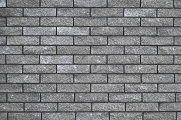 Brick wall texture, seamless stone pattern, gray brickwall, abstract grey background, urban design. House facade backdrop. Decorative tile, wallpaper. Interior decoration. Grunge masonry surface.