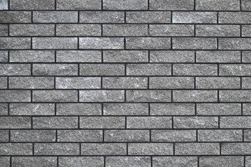 Brick wall texture, seamless stone pattern, gray brickwall, abstract grey background, urban design. House facade backdrop. Decorative tile, wallpaper. Interior decoration. Grunge masonry surface.