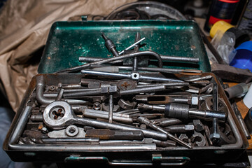 Steel repair toolbox. Dirty tools in the garage.
