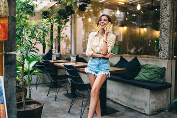 Positive lady talking on phone