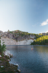 Fototapeta premium Paddleboarding in alpine lake 
