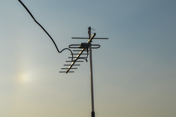 Television aerial, low angle view against the blue sky.
