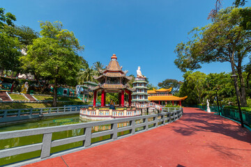 Chinese Pagoda and Pavilion by the Lake at Haw Par Villa Theme Park. This park has statues and dioramas scenes from Chinese mythology, folklore, legends, and history.