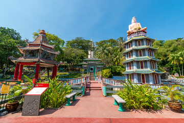 Chinese Pagoda and Pavilion by the Lake at Haw Par Villa Theme Park. This park has statues and...