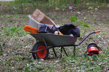 A wheelbarrow full of gardening tools