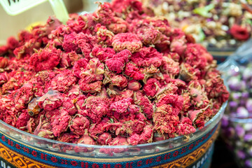 Market with different types of tea , herbs, plants and dried flowers