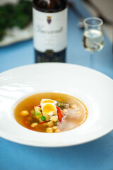 Gourmet vegetable soup on the served table