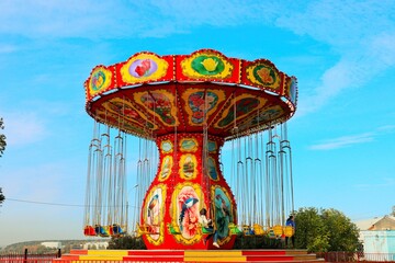 Bright carousels in an amusement park