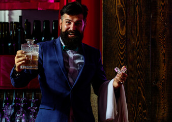 Barman in bar interior making alcohol beverage. Professional bartender.