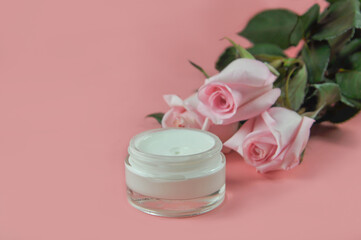 Face cream close - up on a pink background. Body care. Cosmetology. 
