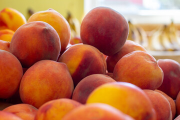 Fototapeta na wymiar Macro Photo food tropical fruit peach. Texture background of sweet red ripe peaches. Image food fruit peaches. Image with selective focus
