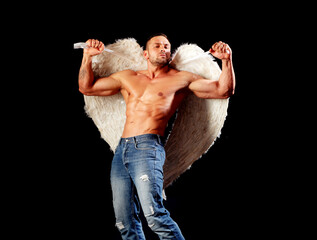 Wings, man angel. Sexy guy with muscular body and bare torso.