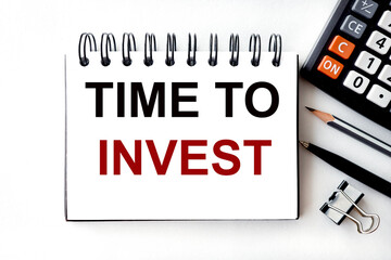 TIME TO INVEST. text on white paper on light background