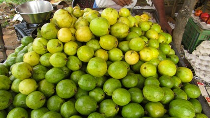 green guavas in a market