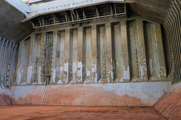 View of cargo hold's bulkhead of bulk carrier just after discharging of bauxite in bulk
