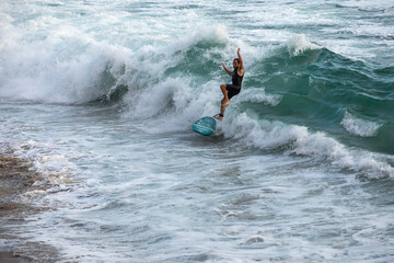 Surfer on big waves in the ocean