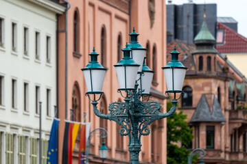 Fototapeta na wymiar Streetlamp in front of historic buildings in Wiesbaden