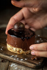 
Chocolate cupcake on a wooden cutting board in rustic style