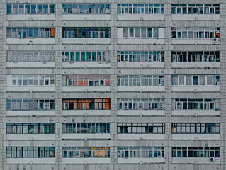 Facade of building in residential district. Soviet era block apartment building