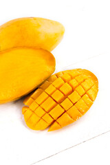 sliced mango on a white background