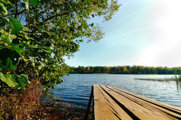 Wooden bridge overlooking the lake in autumn