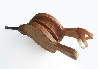 Natural wood and leather bellows for fireplaces and barbarcoas isolated on white background. Wooden...