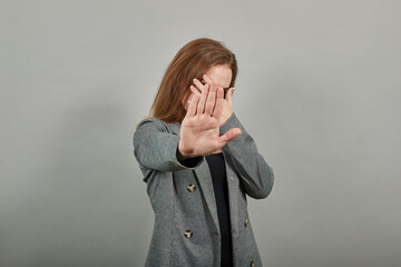 Palm arm raised air angry look straight you will not pass through facial expression harsh. Serious...