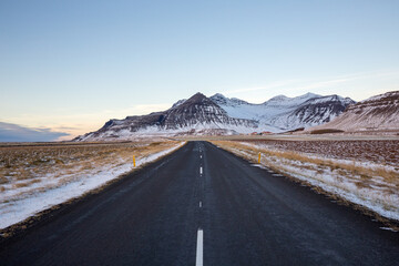 Naklejka premium Empty road and mountains in winter, Iceland 