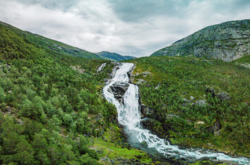 Nyastolfossen falls, second in cascade of four waterfalls in Husedalen valley, Kinsarvik, Norway