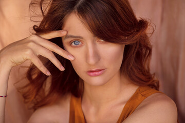 Obraz premium portrait beautiful of a red-haired girl with blue eyes.close up