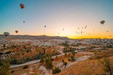 Kapadokya Beautiful vibrant colorful balloons in sunrise light in Cappadocia Turkey Goreme