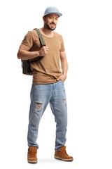 Fototapeta premium Full length portrait of a guy with a cap carrying a backpack