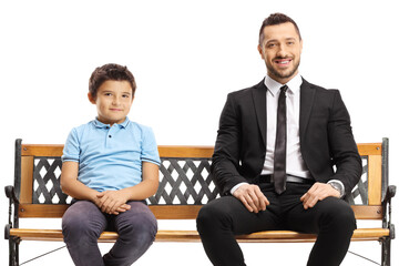 Businessman and a boy sitting on a bench