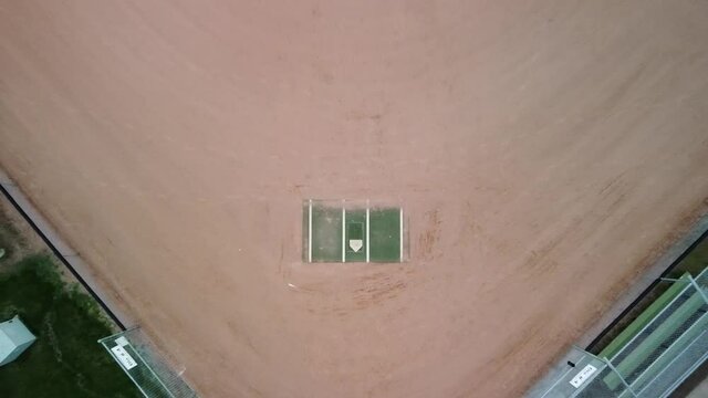 Baseball diamond aerial birds eye view pulling back to reveal field